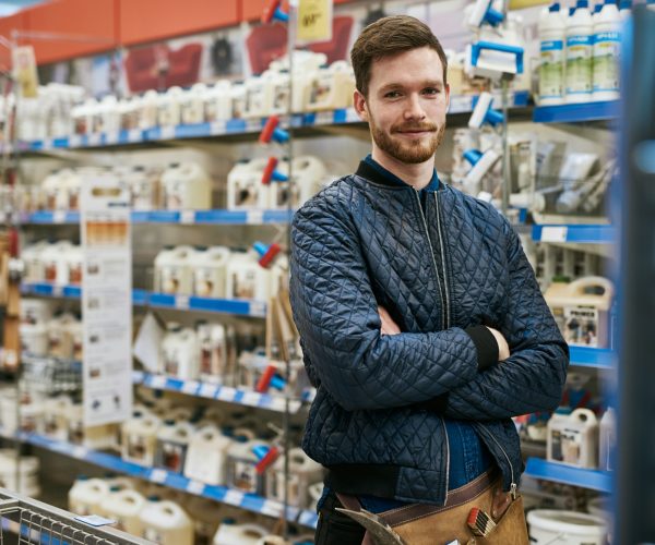 Confident handyman in a hardware store